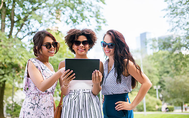 Image showing women with tablet computer on street in summer