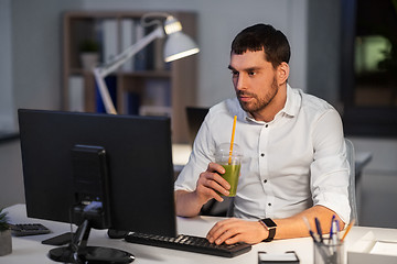 Image showing businessman with computer working at night office