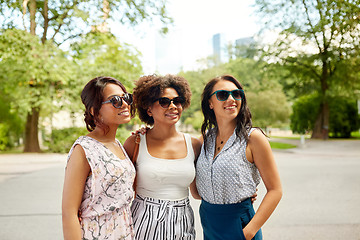 Image showing happy young women in sunglasses at summer park