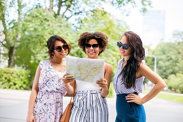 Image showing happy women with map on street in summer city