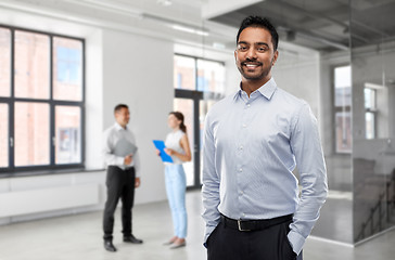 Image showing indian businessman or realtor in empty office room