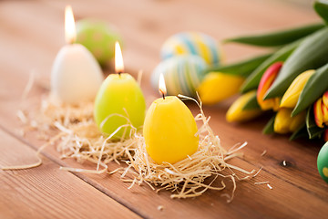 Image showing candles in shape of easter eggs and tulip flowers