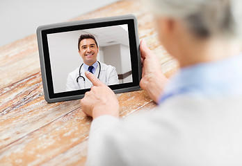 Image showing senior woman patient having video call with doctor