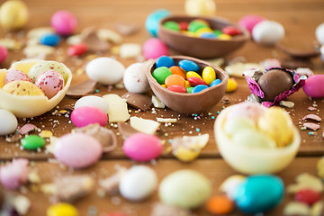 Image showing chocolate easter eggs and candy drops on table