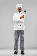 Image showing happy male indian chef in toque with ladle