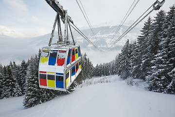 Image showing Skiing lift cabin over a valley