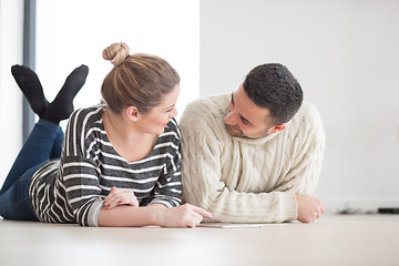 Image showing Young Couple using digital tablet on cold winter day