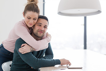 Image showing couple hugging in their new home