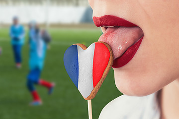 Image showing Lips and cookie with flag