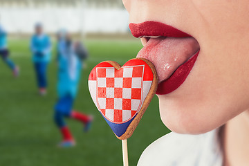 Image showing Lips and cookie with flag