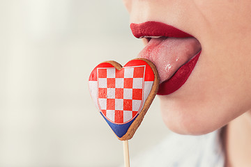 Image showing Lips and cookie with flag