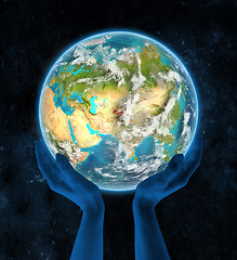 Image showing Tajikistan on planet Earth in hands