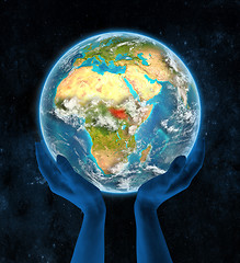 Image showing South Sudan on planet Earth in hands