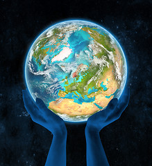 Image showing Norway on planet Earth in hands