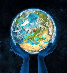 Image showing Finland on planet Earth in hands