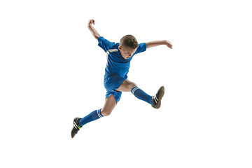 Image showing Young boy with soccer ball doing flying kick