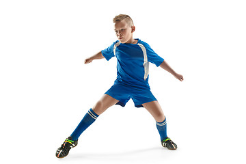 Image showing Young boy with soccer ball doing flying kick