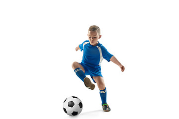 Image showing Young boy with soccer ball doing flying kick