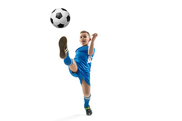 Image showing Young boy with soccer ball doing flying kick