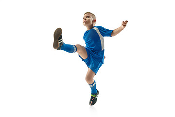 Image showing Young boy with soccer ball doing flying kick