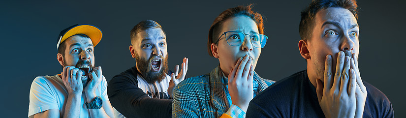 Image showing The emotional angry men screaming on blue studio background