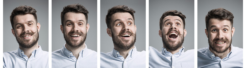 Image showing Set of young man\'s portraits with different happy emotions