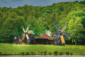 Image showing Windmills on the Bank of Lake