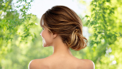 Image showing young woman from back over grey background