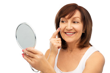 Image showing portrait of smiling senior woman with mirror
