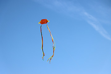 Image showing Colorful kite flying and blue sky as background