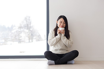 Image showing asian woman enjoying morning coffee