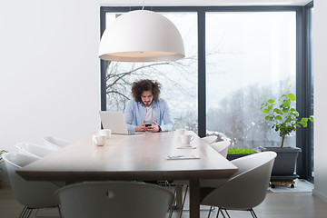 Image showing Young casual businessman using smartphone