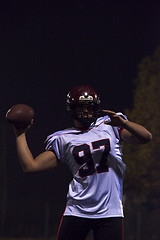 Image showing american football player throwing rugby ball