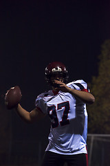 Image showing american football player throwing rugby ball