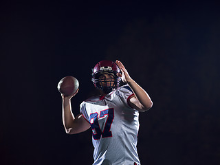 Image showing american football player throwing rugby ball