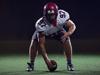 Image showing American football player starting football game