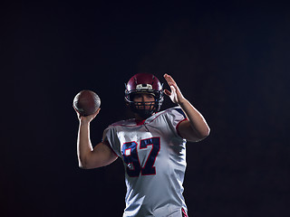 Image showing american football player throwing rugby ball