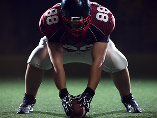 Image showing American football player starting football game