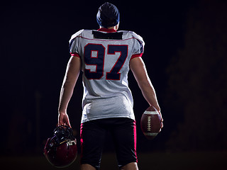 Image showing rear view of young confident American football player