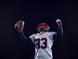 Image showing american football player celebrating after scoring a touchdown