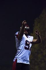 Image showing american football player throwing rugby ball