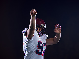 Image showing american football player throwing rugby ball