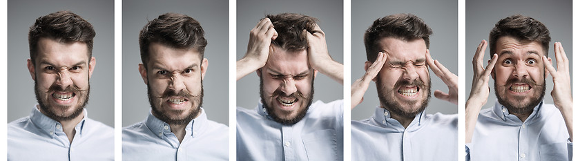 Image showing Set of young man\'s portraits with different sad and angry emotions