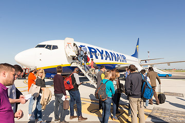 Image showing Trieste airport, Italy - 20 April 2018: People boarding Ryanair plane on Friuli Venezia Giulia Airport in Trieste, italy on April 20th, 2018. Ryanair is the biggest low-cost airline company in Europe