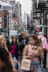 Image showing New York, NY, USA - May 17, 2018: Crowds of people walking sidewalk of Broadway avenue in Soho of Midtown Manhattan on may 17th, 2018 in New York City, USA.