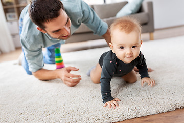 Image showing happy little baby girl with father at home