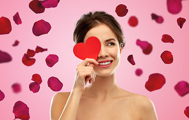 Image showing beautiful smiling woman holding red heart