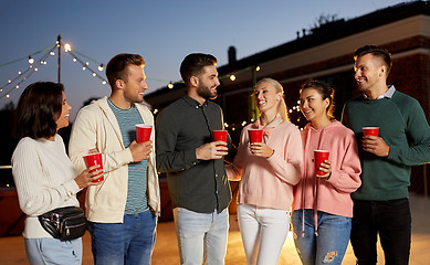Image showing friends with drinks at rooftop party
