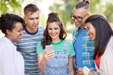 Image showing group of happy friends with smartphone outdoors