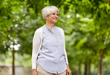 Image showing happy senior woman at summer park